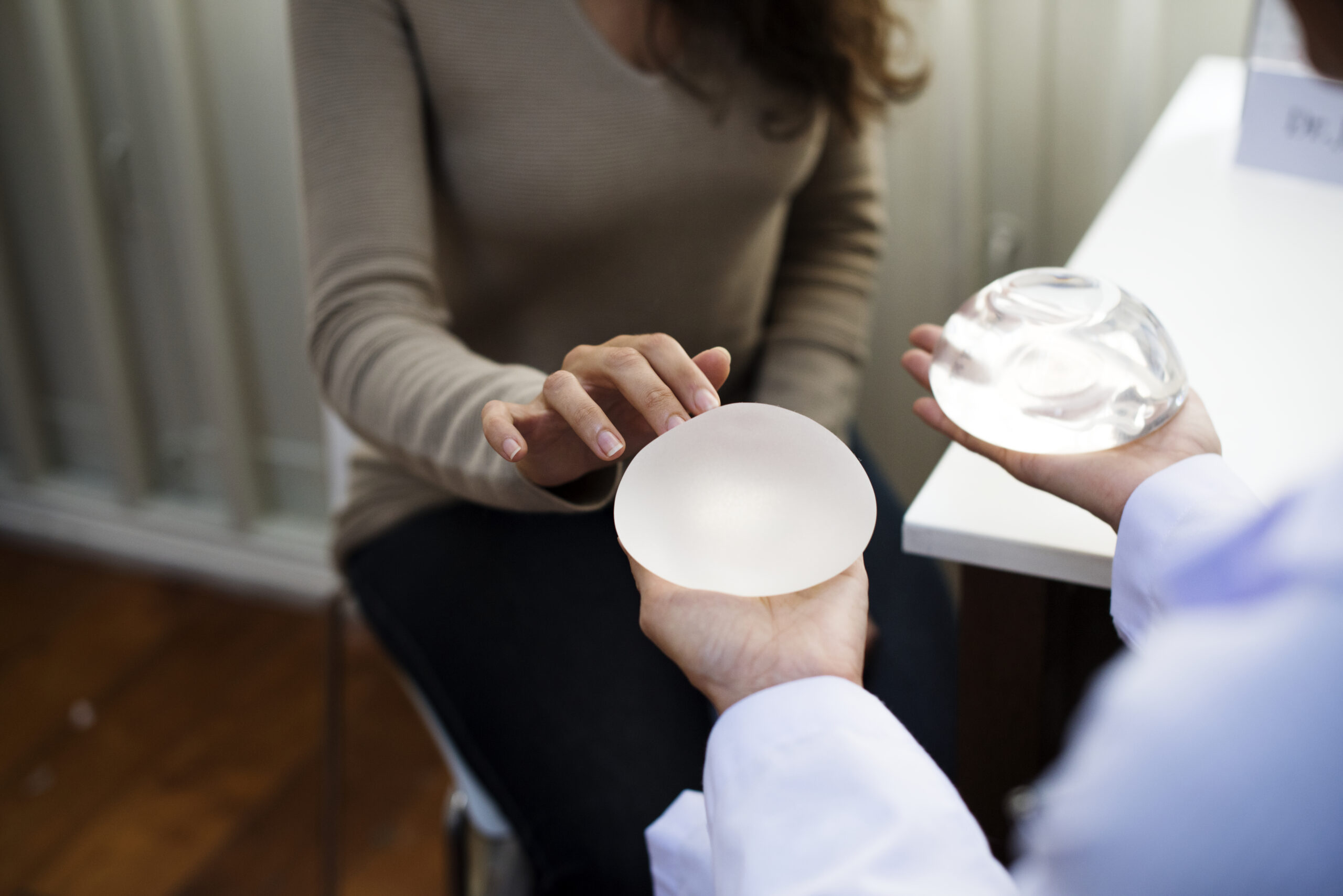 woman-meeting-with-doctor-about-breast-implant-surgery